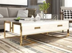 Table basse design laqué blanc et pieds acier effet or miroir Raluxe 130 cm
