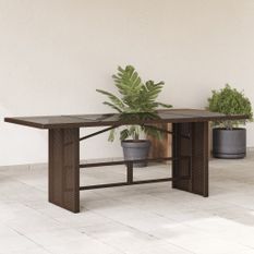 Table de jardin avec dessus en verre marron résine tressée