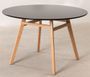 Table ronde 120 cm scandinave noir et pieds bois clair Bristol